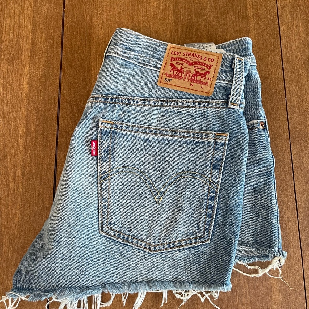 Levi’s 501 mid-rise frayed denim shorts